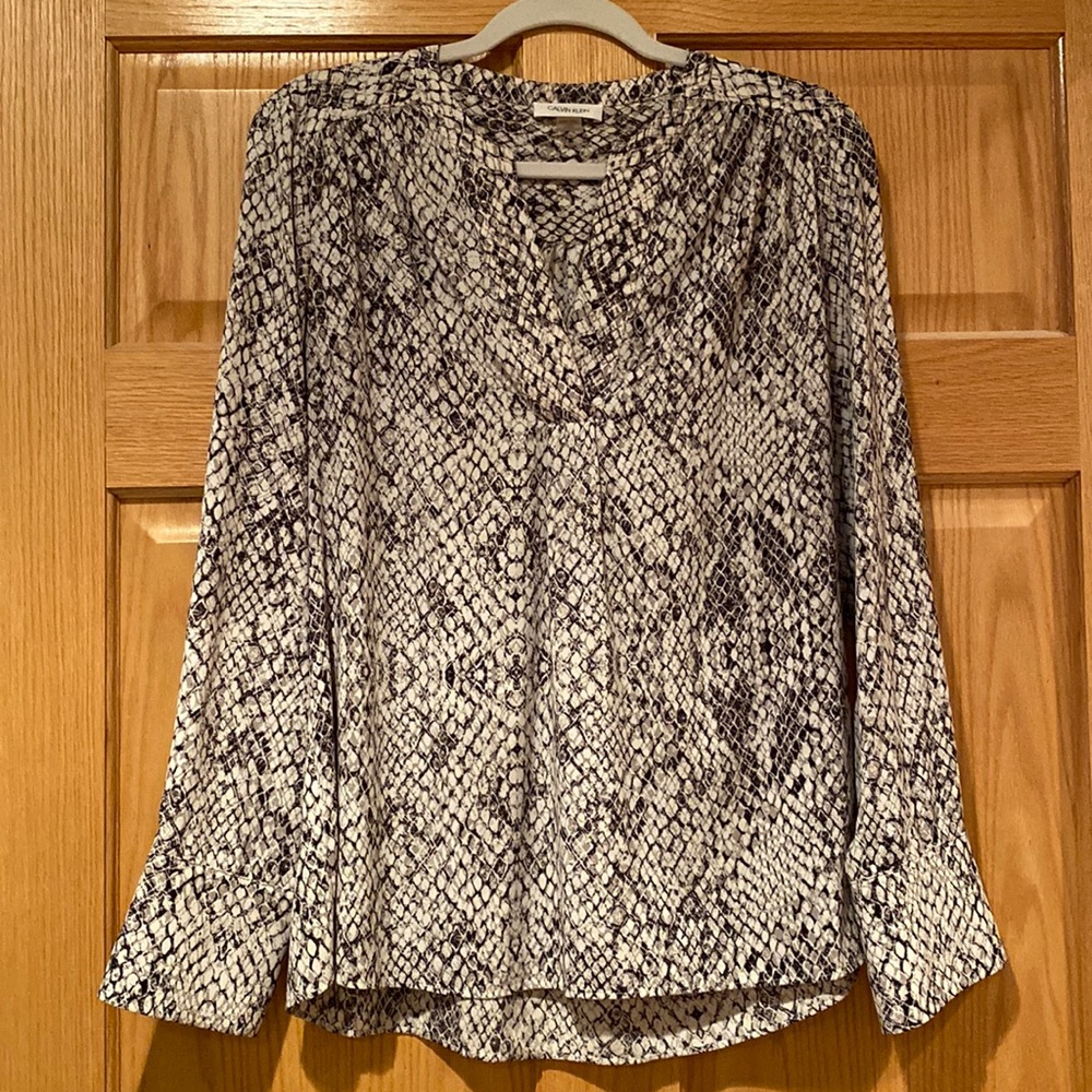 Lightly worn large top.